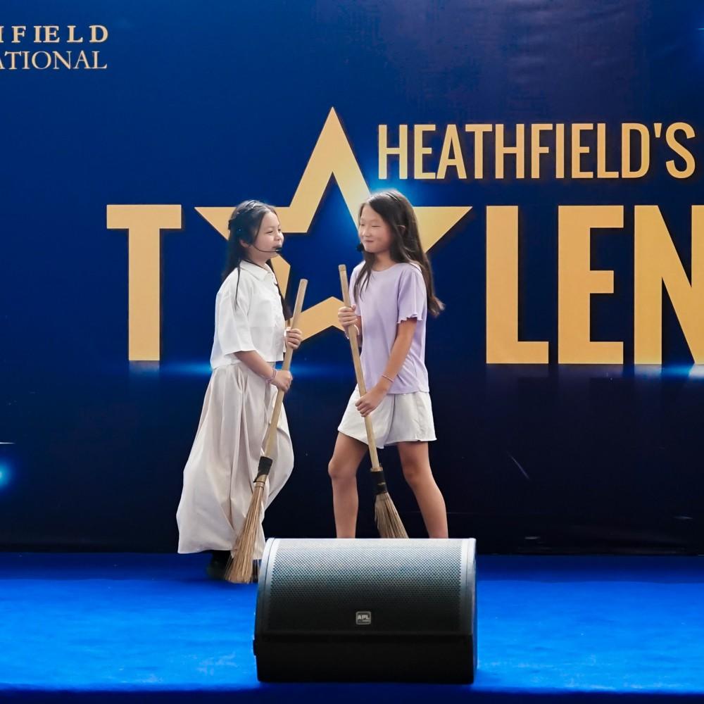 Friends sing together on stage at Heathfield's Got Talent.