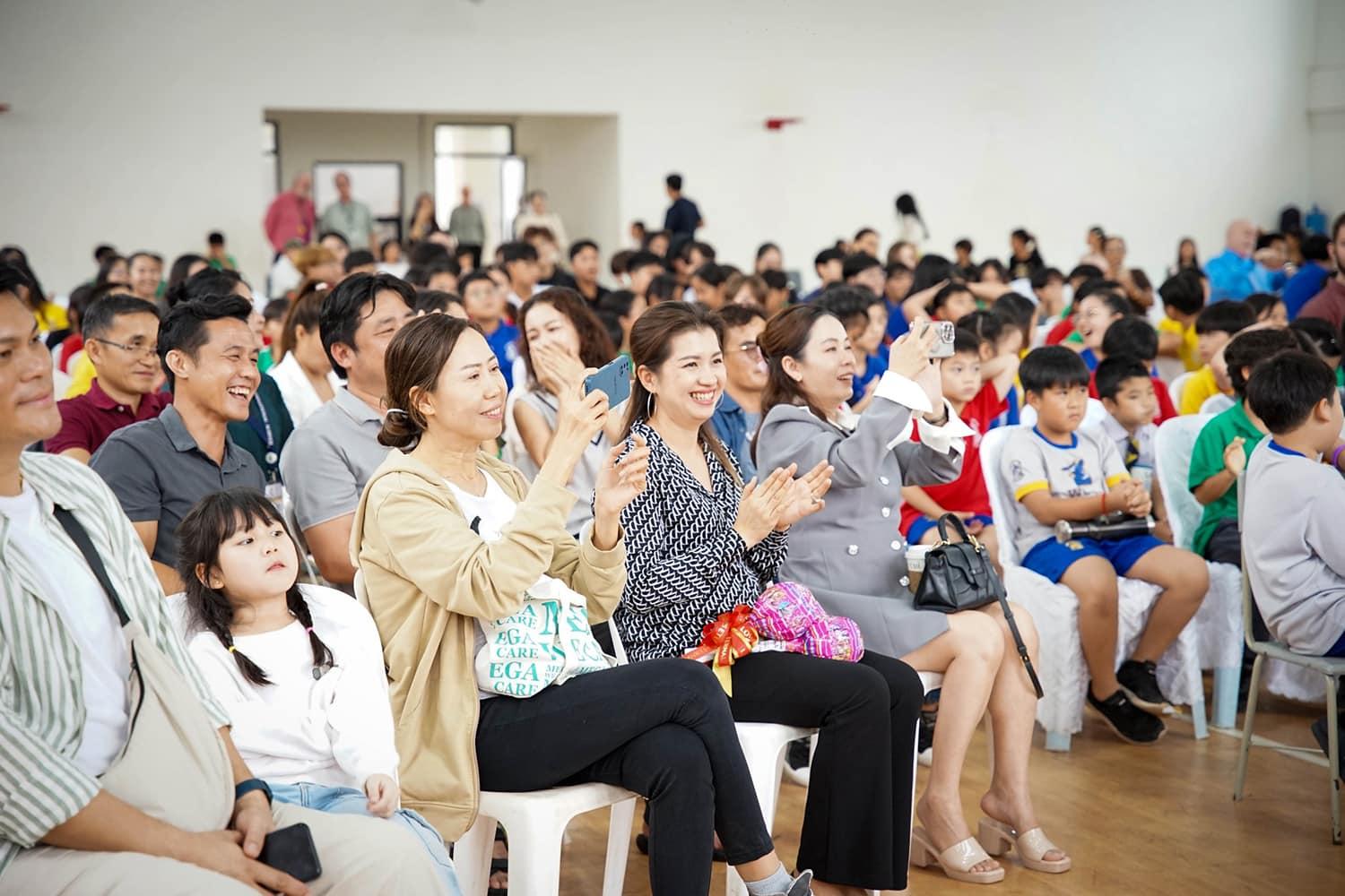 Parents watching their children perform