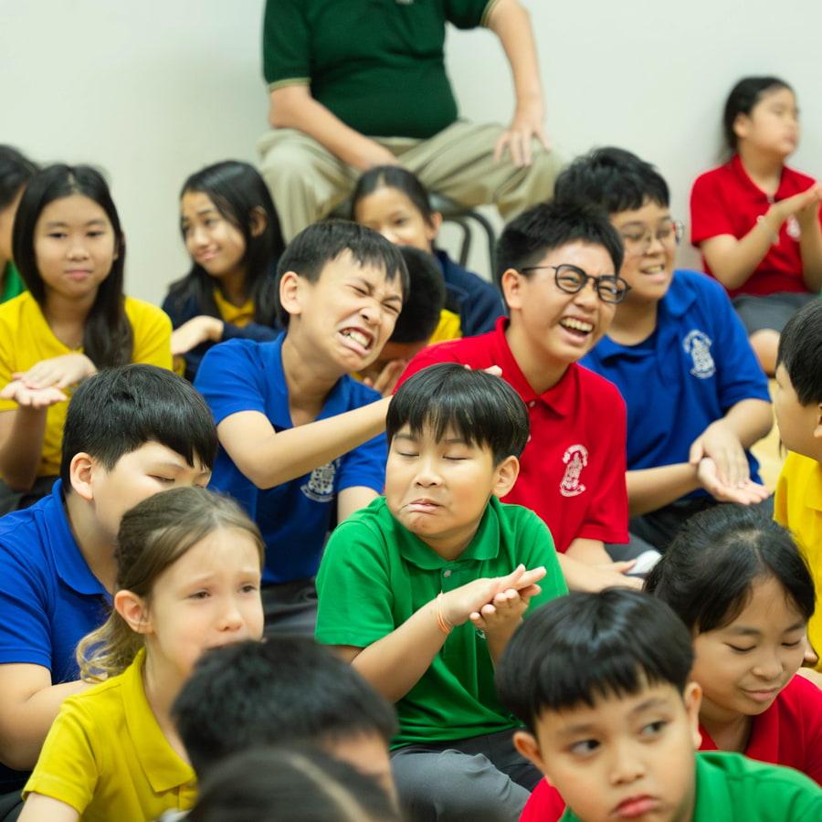 Young students practicing sign language