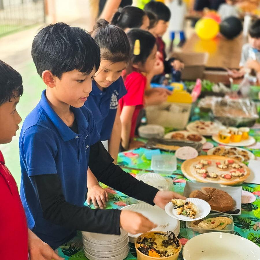Students plating baked goods for a bake sale