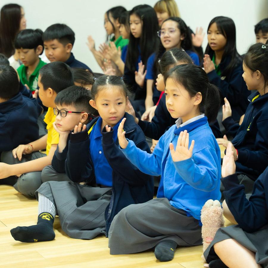 Young students practicing sign language