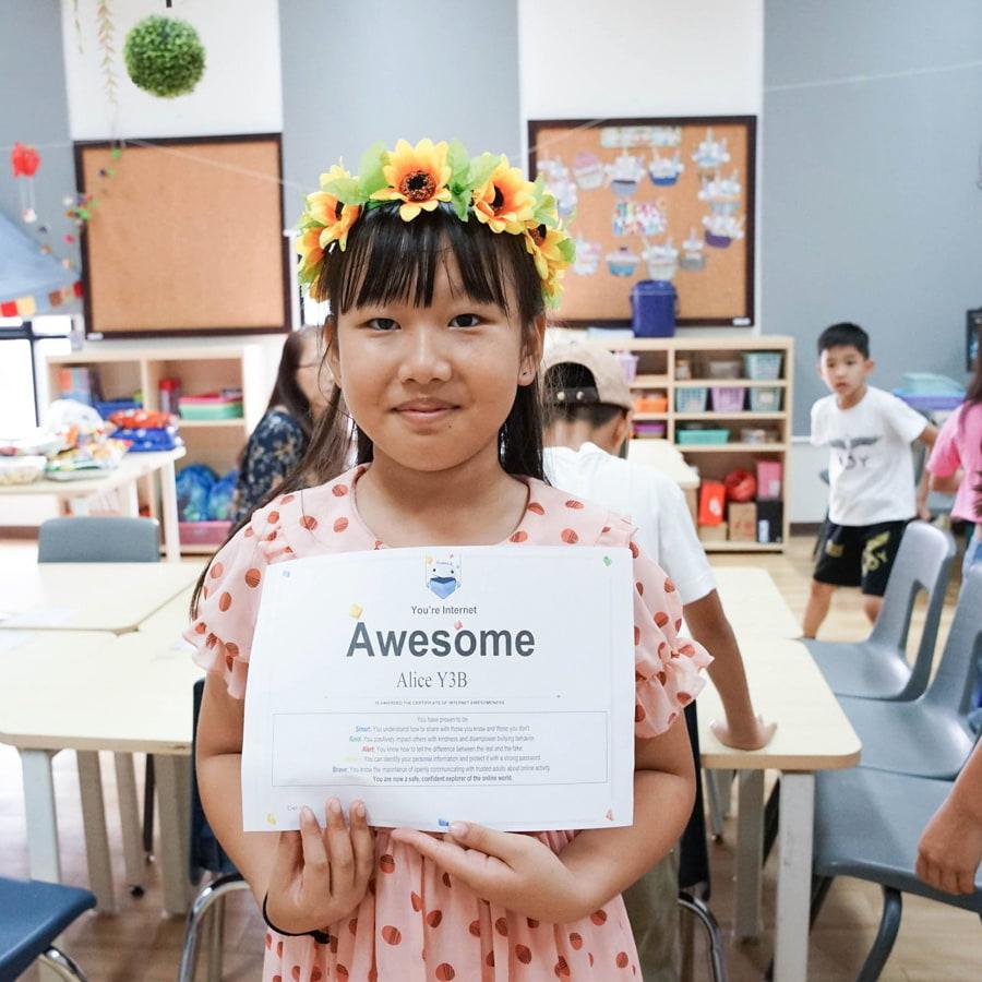 Student holding a certificate of achievement