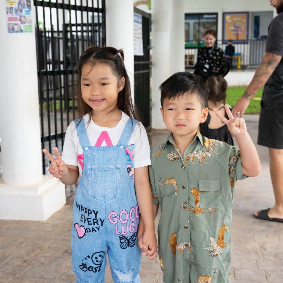 Two students posing in spirit wear