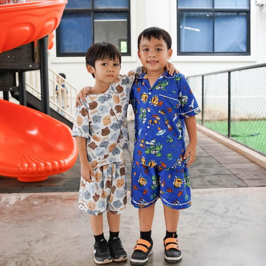 Two young students wearing pajamas