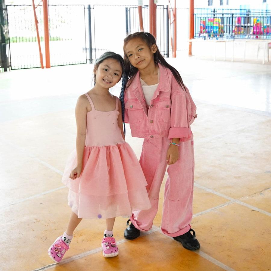 Two students posing in spirit wear