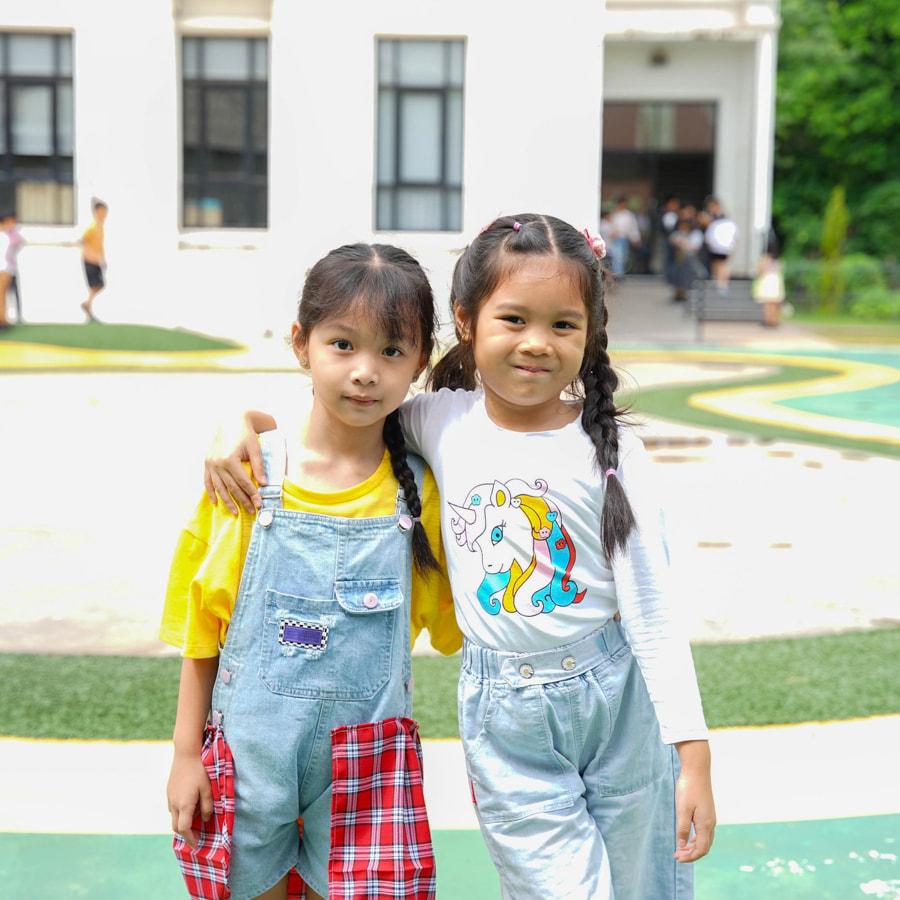Two students posing in spirit wear