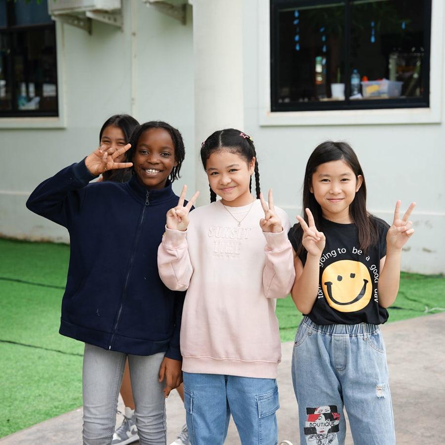 Three students posing in spirit wear