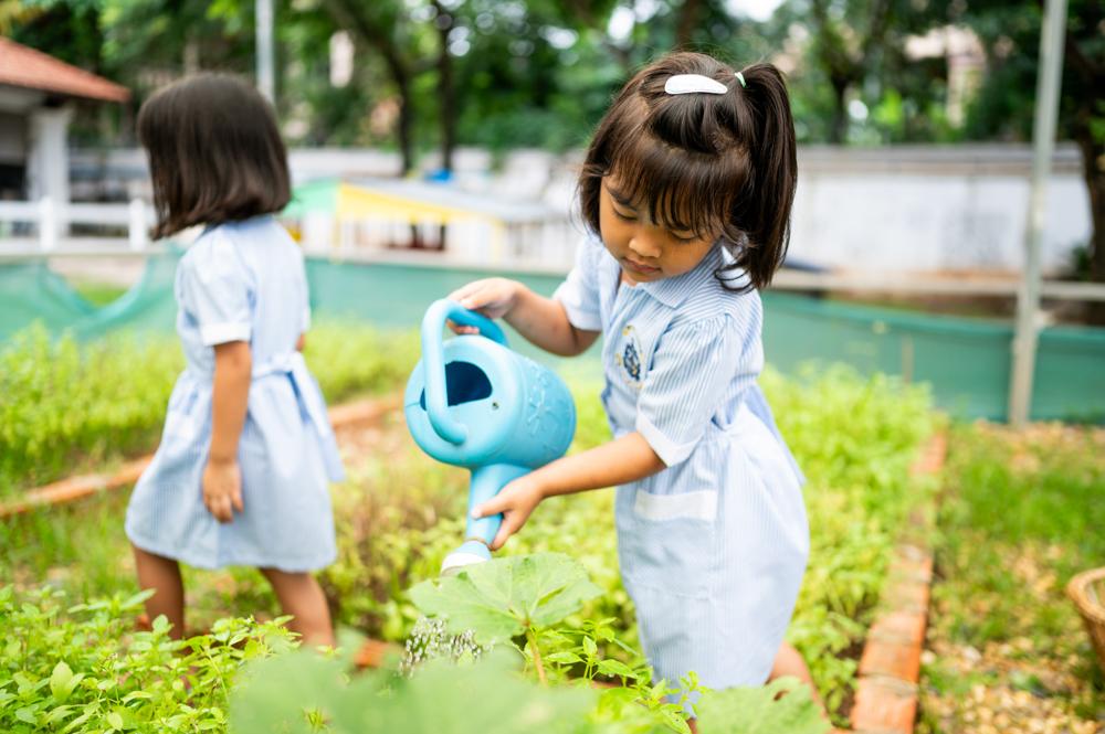 Child looking through magnifying glass